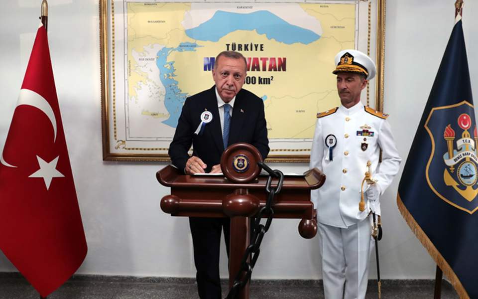 Greece hits back at Erdogan over map in the photo background