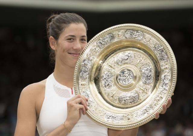 Wimbledon champion Muguruza eyes more trophies not rankings
