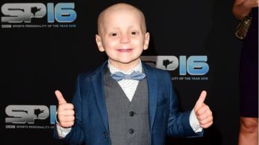 Mourners line streets for funeral of UK child cancer victim