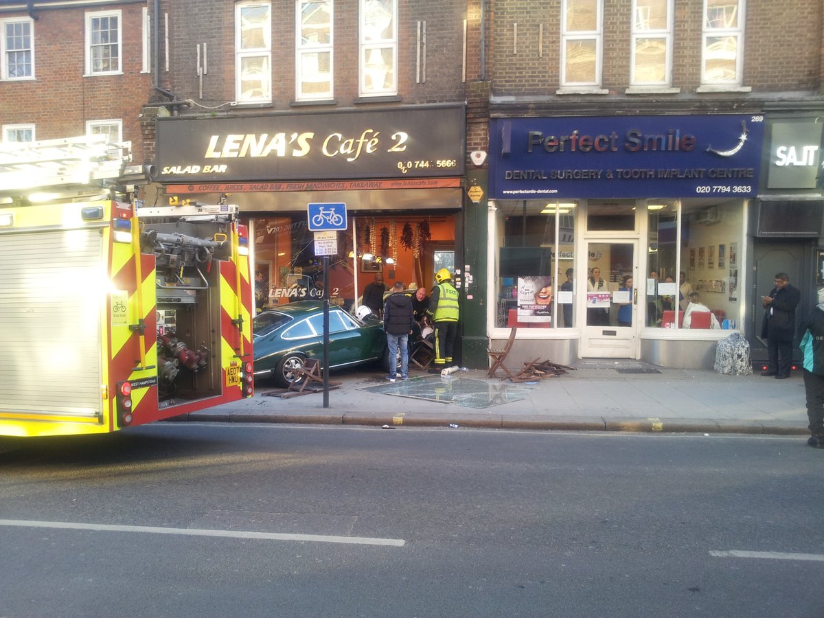 Car in collision with cafe