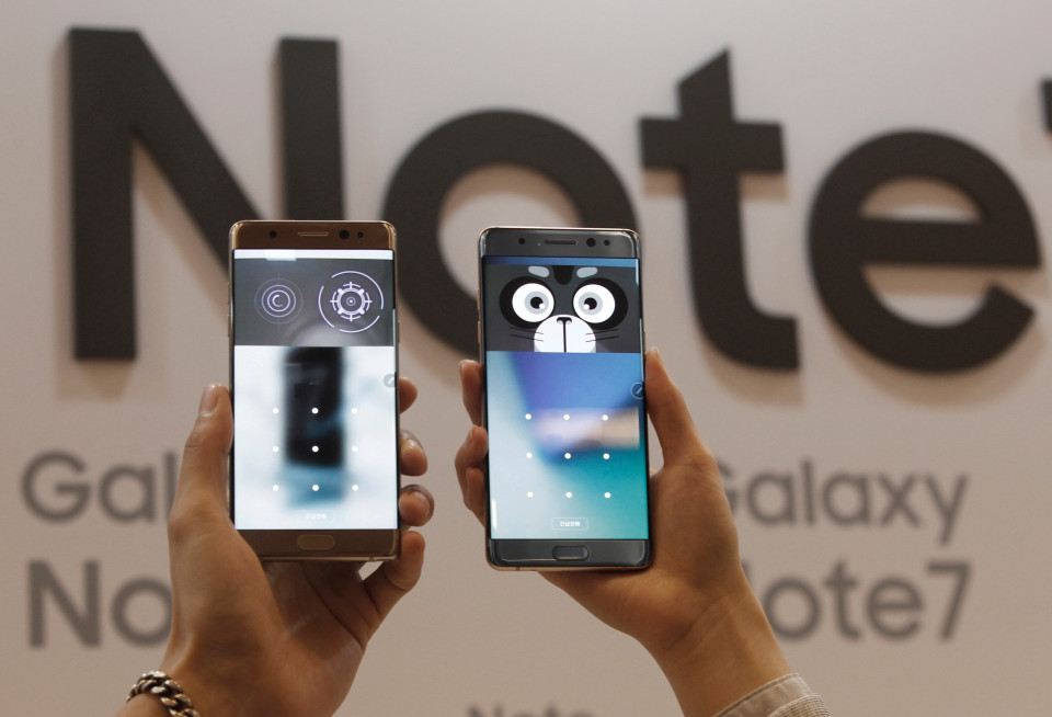 FILE - In this Thursday, Aug. 11, 2016, file photo, models display the iris scanner features of the Samsung Galaxy Note 7 smartphones during its launch event at the company's headquarter in Seoul, South Korea. Samsung on Thursday, Sept. 1, 2016, has delayed shipments of Galaxy Note 7 smartphones in South Korea for quality control testing after reports that batteries in some of the jumbo smartphones exploded while they were being charged. (AP Photo/Ahn Young-joon. File)