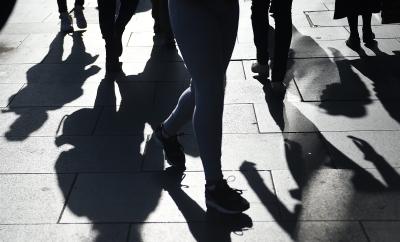 epaselect epa04625465 Shadows of pedestrians are cast in London, Britain, 18 February 2015. Unemployment in Britain has fallen to its lowest rate in six years, the Office for National Statistics said 18 February.  EPA/ANDY RAIN