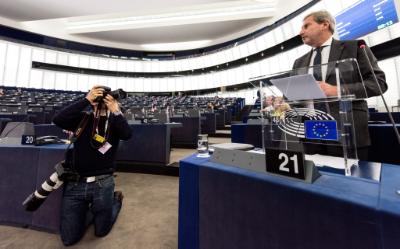 epa05141358 Austrian European Commissioner for European Neighborhood Policy and Enlargement Negotiations Johannes Hahn prepares for his speech in the debate about the progress report on Serbia in the European Parliament in Strasbourg, France, 03 February 2016.  EPA/PATRICK SEEGER