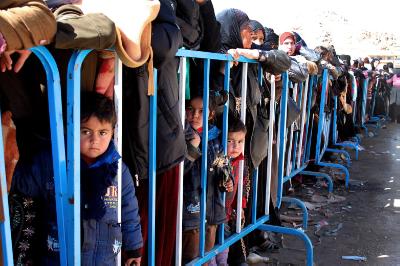 epa04086184 Syrian refugees, who fled the violence from Flita and Yabroud areas in Syria, wait to register after their arrival in Arsal village near Syrian border, in Lebanon, 18 February 2014. Syrian citizens fled their country into Lebanon after intensified fighting between government forces and rebels near the Lebanese border.  EPA/STR