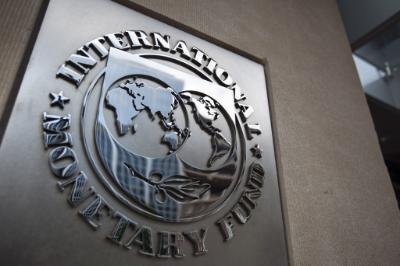 epa04824587 (FILE) A file photo dated 18 May 2011 showing the logo of the International Monetary Fund (IMF) at the entrance of the Headquarters of the IMF, also known as building HQ2, in Washington, DC, USA. Greece will not make the 1.6-billion-euro (1.8-billion-dollar) repayment due 30 June 2015 to the International Monetary Fund unless it strikes a deal in the coming hours with its creditors, Prime Minister Alexis Tsipras said in Athens as the deadline loomed. He implied that his left-wing government would resign if Greeks vote 'yes' in a planned 05 July referendum on a renegotiated bailout. The Greek vote is widely seen as deciding whether the near-bankrupt country stays in the eurozone. No country has left the currency bloc since its founding in 1999.  EPA/JIM LO SCALZO *** Local Caption *** 51301299