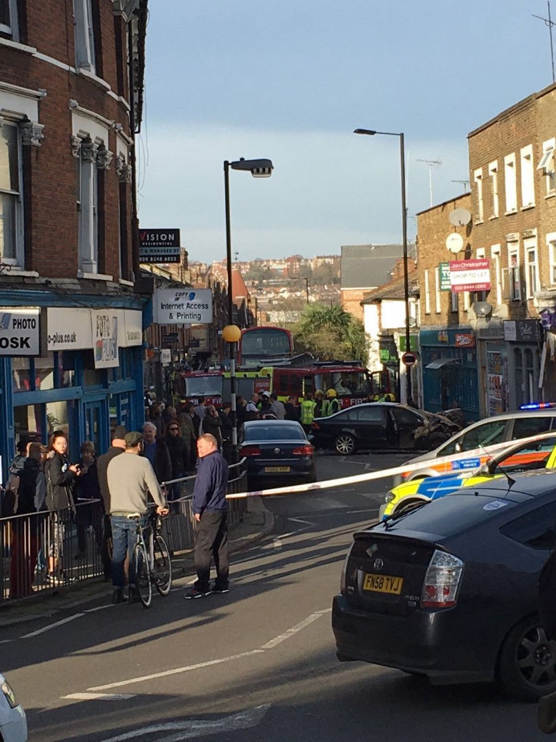 Police car chase ends with car going through shop window in Crouch End