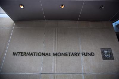 epa04143038 (FILE) A file photo dated 18 May 2011 showing the sign and name of the International Monetary Fund at the entrance of the Headquarters of the IMF, also known as building HQ2, in Washington, DC, USA. The International Monetary Fund (IMF) on 27 March 2014 offered Ukraine between 14 and 18 billion dollars in loans over two years to help the country avoid financial collapse after months of unrest that culminated in Russia's annexation of the Crimean Peninsula. Ukraine's interim leaders, who came to power after three months of pro-European Union protests that forced president Viktor Yanukovych to flee the country in late February, have already started discussing a series of reforms aimed at stabilizing the economy. Measures announced by interim prime minister Arseniy Yatsenyuk on Thursday include axing 24,000 public sector jobs and special pensions for members of the judiciary and the military, as well as a 50-per-cent increase in gas prices, starting on May 1.  EPA/JIM LO SCALZO