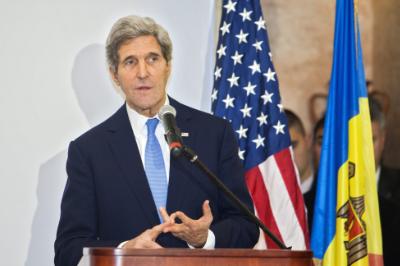 epa03976770 John Kerry (L), US Secretary of State gestures during his speech at Cricova winery, 17 Km North from Chisinau, during his official visit in Moldova, 04 December 2013. John Kerry has a short official visit to Moldova, to encourage the european course of Moldova. He will also visit Belgium, Israel and the West Bank.  EPA/DUMITRU DORU
