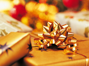 Close-Up of Christmas Presents with out of focus xmas tree in the background