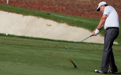 epa03950918 Marcus Fraser of Australia plays a shot during the second round of the World Tour Championship golf tournament at Jumeirah Golf Estates in Dubai, United Arab Emirates, 15 November 2013.  EPA/ALI HAIDER