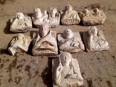epa04110095 A handout picture made available by the official Syrian Arab News Agency (SANA) on 04 March 2014 shows pieces of ancient sculpture seized in terrorists den in Palmyra in Homs province, Syria. A source at the governorate of Homs told SANA on 04 March that component authorities seized nine stolen archeological pieces inside a terrorist den in Palmyra farms.  EPA/SANA HANDOUT 
 HANDOUT EDITORIAL USE ONLY/NO SALES HANDOUT EDITORIAL USE ONLY/NO SALES