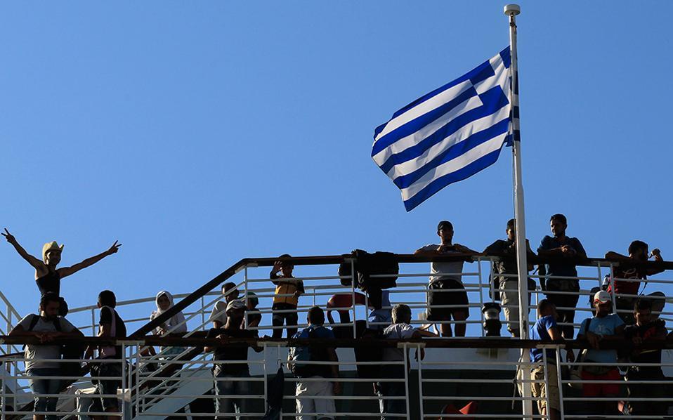 Ferry carrying 2,500 refugees and migrants docks at Piraeus in Greece