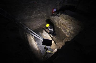 epa04100127 State archaeologist Ronald Knoechlein digs in the foundation of the St. John's Church in Mainz, Germany, 25 February 2014. An ancient cathedral from the times of Charles the Great was discovered under the church during excavations. According to experts the found cathedral could be the second oldest church on German grounds.  EPA/FREDRIK VON ERICHSEN