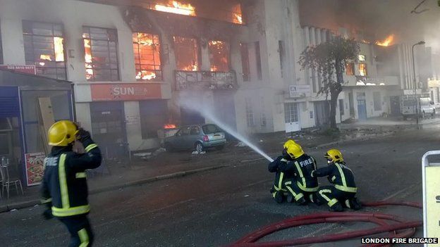 Black smoke roll over London as 100 firefighters tackle warehouse inferno