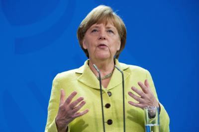 epa04779270 German Chancellor Angela Merkel gives a statement during a joint news conference with Benoit Potier, chief of the European Round Table of top industrialists, French President Francois Hollande and European Commission president Jean-Claude-Juncker (all unseen) following a meeting in Berlin, Germany, 01 June 2015. Merkel and  Hollande met in Berlin as the negotiations over the Greek debt crisis hang in the balance. The meeting was also attended by the President of the European Commission Jean-Claude Juncker as well as by Benoit Potier, who heads up the so-called European Round Table of top industrialists.  EPA/MAURIZIO GAMBARINI
