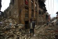 Nepalese dig with bare hands for quake survivors as toll exceeds 1,900