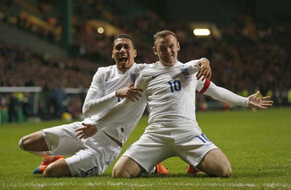 Rooney’s double beats Scotland