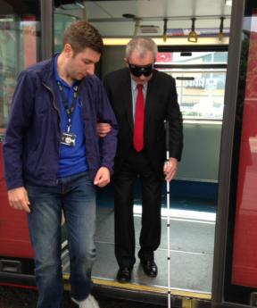Edmonton MP Andy Love takes blindfolded bus journey to support campaign to introduce talking buses across UK