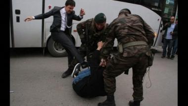Photographs show an aide of Turkish Prime Minister appearing to kick a protester in the aftermath of the Soma mine disaster.