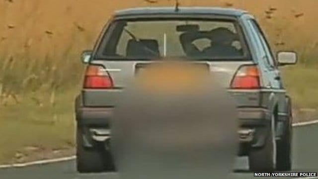 Man banned after being filmed driving with hands behind head