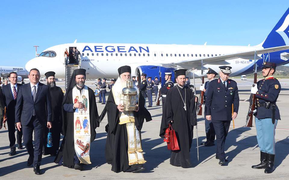 Holy Light arrives in Athens , to stay confined