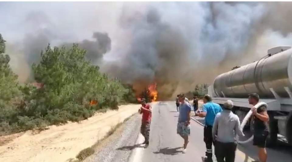 Greek and Turkish Cypriots join to fight wildfire in north