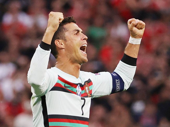 Record-breaking Ronaldo strikes late as Portugal sink Hungary