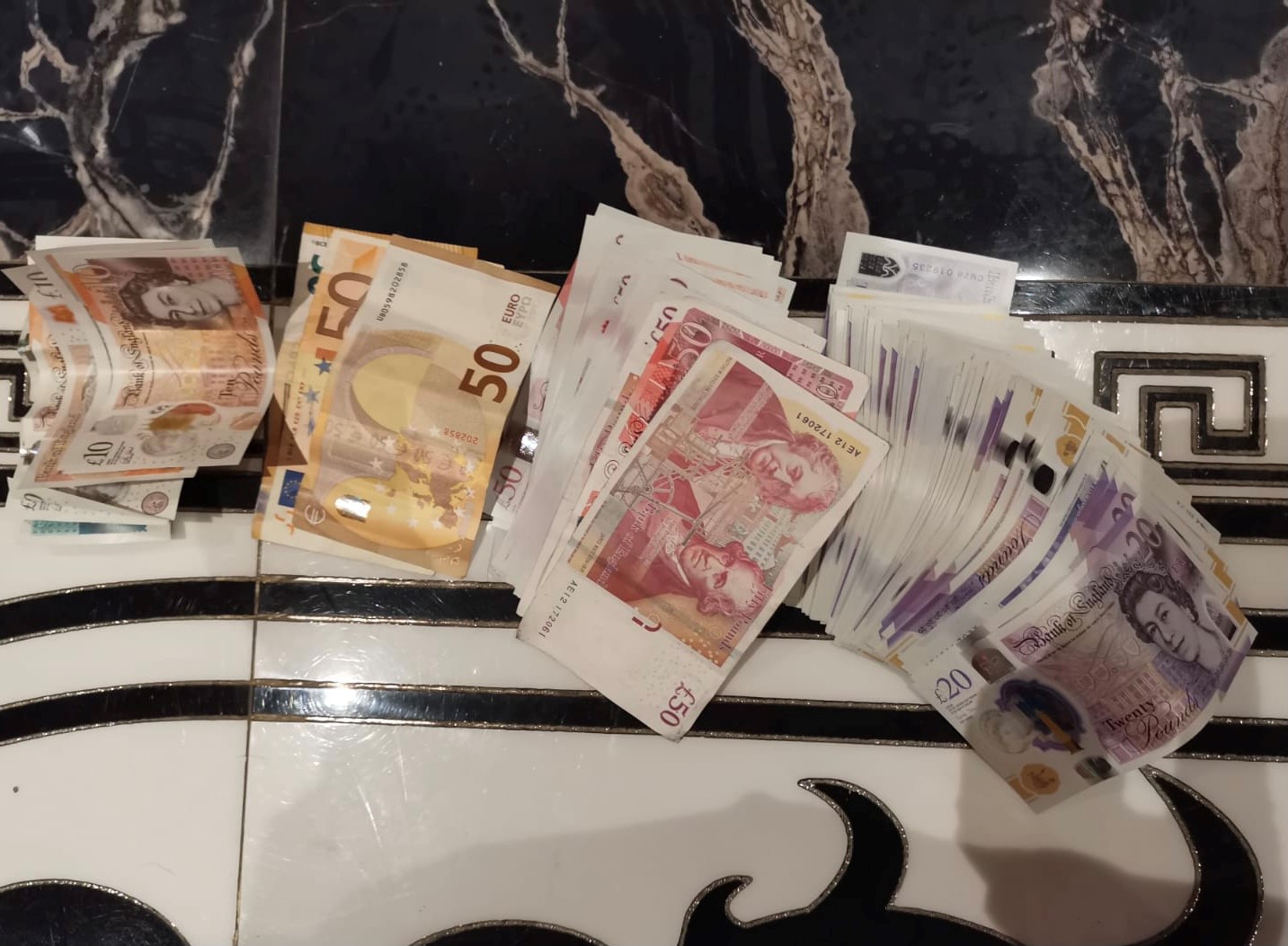Thirteen people have been arrested in raids in London and Romania on suspicion of trafficking offences