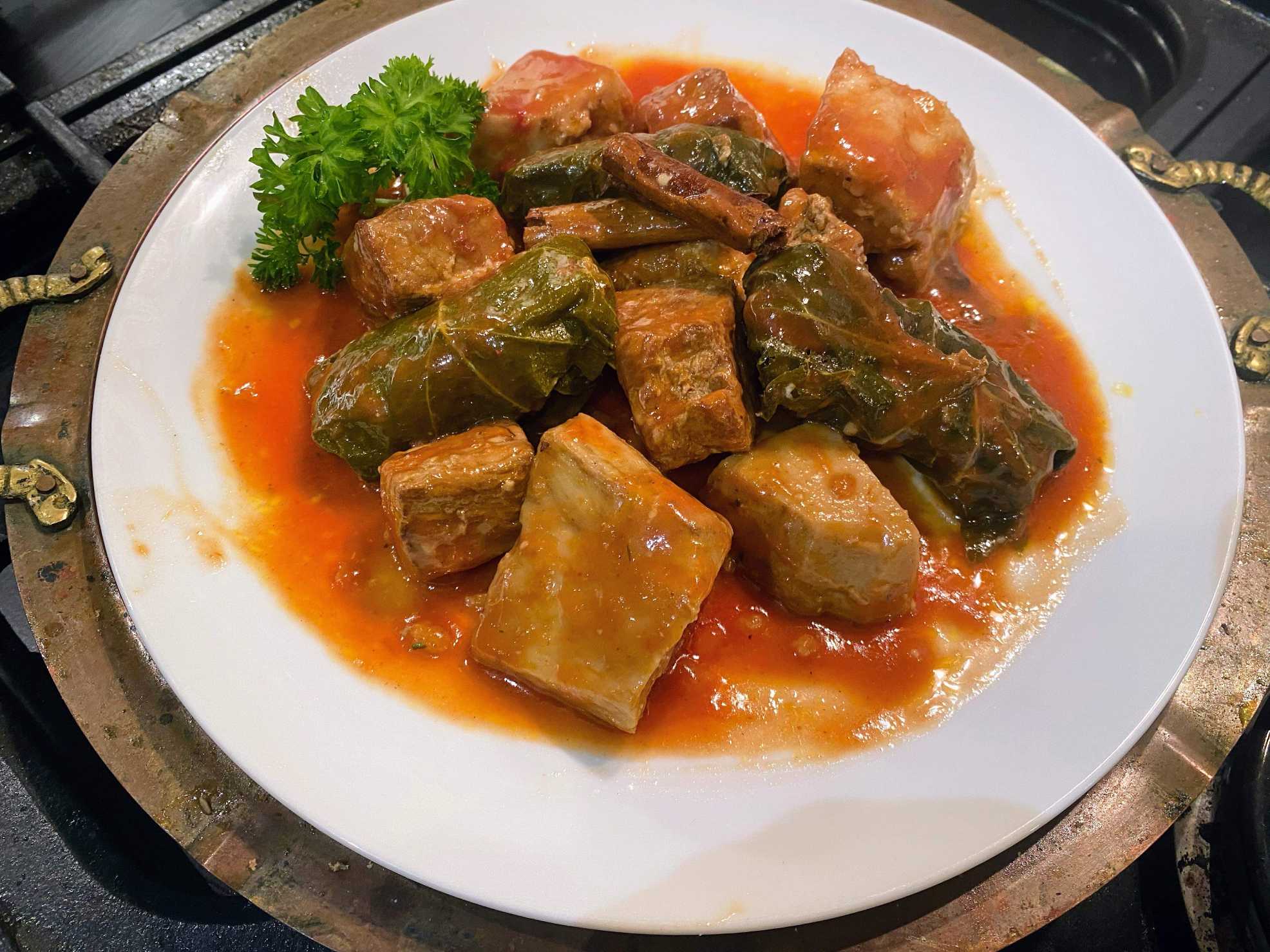 Cooking with UK Cypriot Loulla Astin Pork stew with taro root and stuffed vine leaves