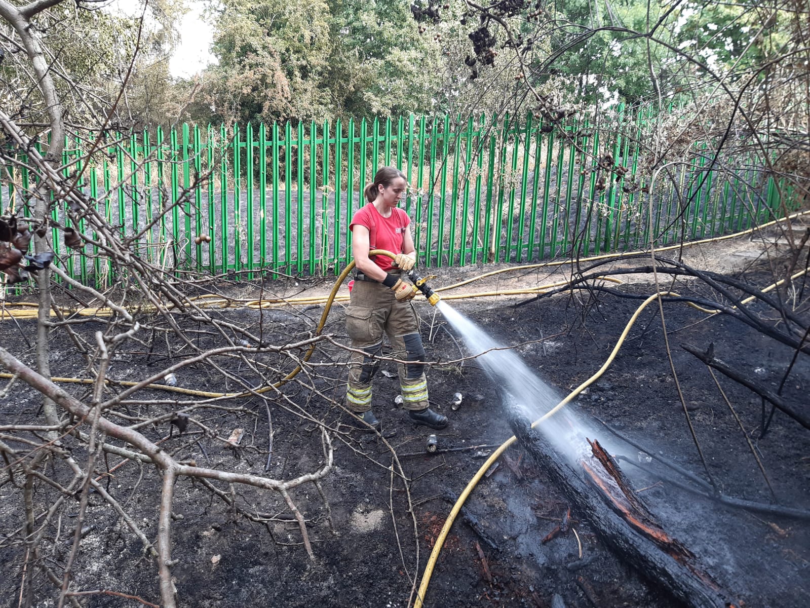 Grass fire in fields surrounding a school in Enfield.