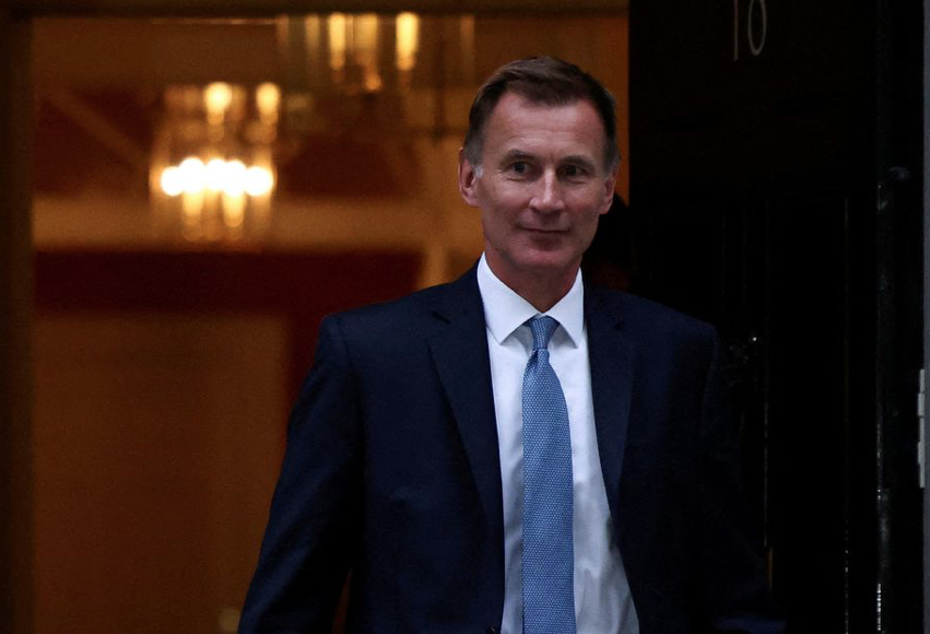 New UK finance minister Hunt scraps tax cuts, reins in energy support