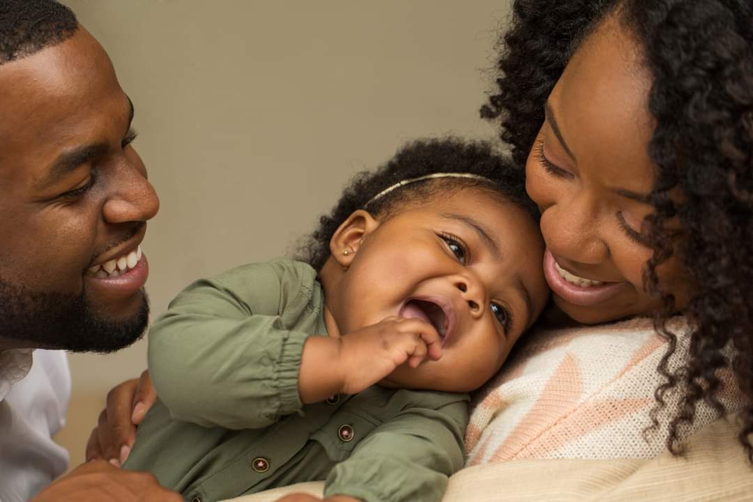 Happy family with their baby.