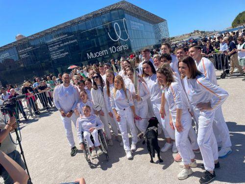 Cypriot Paralympic swimmer represents Cyprus at Olympic Torch Relay in France