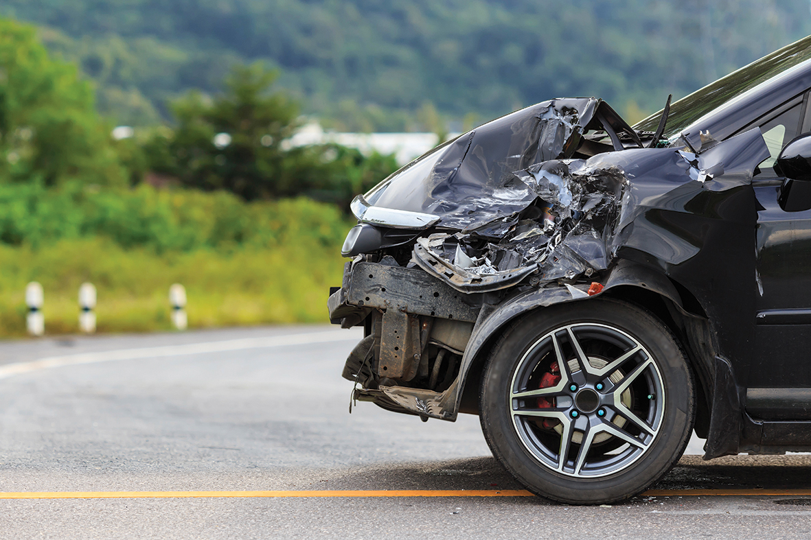 Front of black car get damaged by accident on the road
