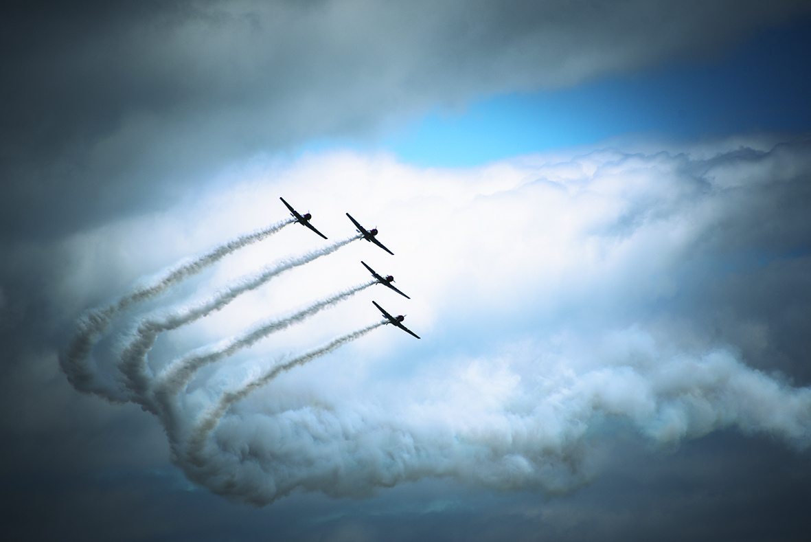 A row of jets flying in the sky in celebration